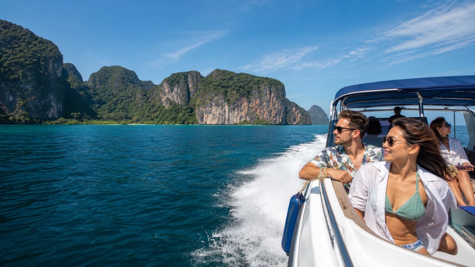 Travelers taking a speedboat toward Phuket limestone islands